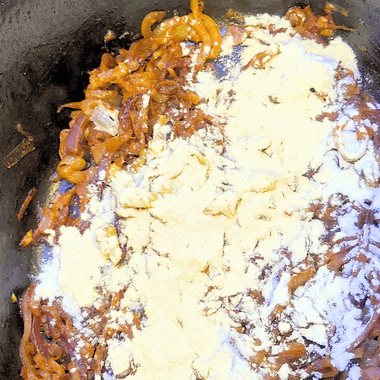 Image of Then, add the flour. Cook over medium heat for a few minutes, ensuring the flour browns.