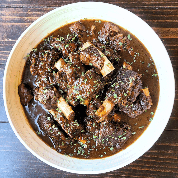 Image of Once the ribs are tender, carefully transfer them to a serving dish. Season with salt and black pepper, then ladle sauce over them. Serve with your favorite sides. We suggest mashed potatoes, garlic or fresh bread, roasted root vegetables, or...