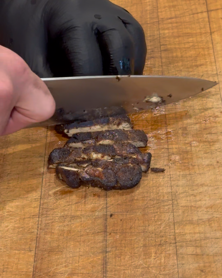 Image of Spoon the pan sauce on a plate and pan the mushroom slices over the sauce.