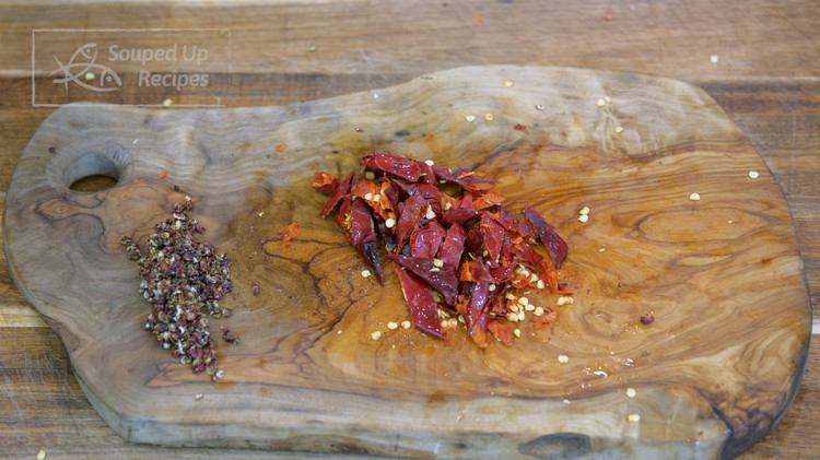 Image of During this time, press the Sichuan peppercorn with a heavy-duty cleaver, then chop as fine as possible. They are very crispy after toasted, so they should crush easily. If you don't have a cleaver, a mortal and pestle will do the same job. Once...