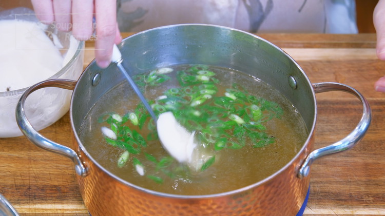 Image of Season the broth with 3 Tbsps of soy sauce, 1 tsp of salt, 1/2 tsp of ground white pepper, some diced scallion, and 2 Tbsps of pork lard, which adds a rich flavor and makes this noodle soup Shanghai style. Even though the...