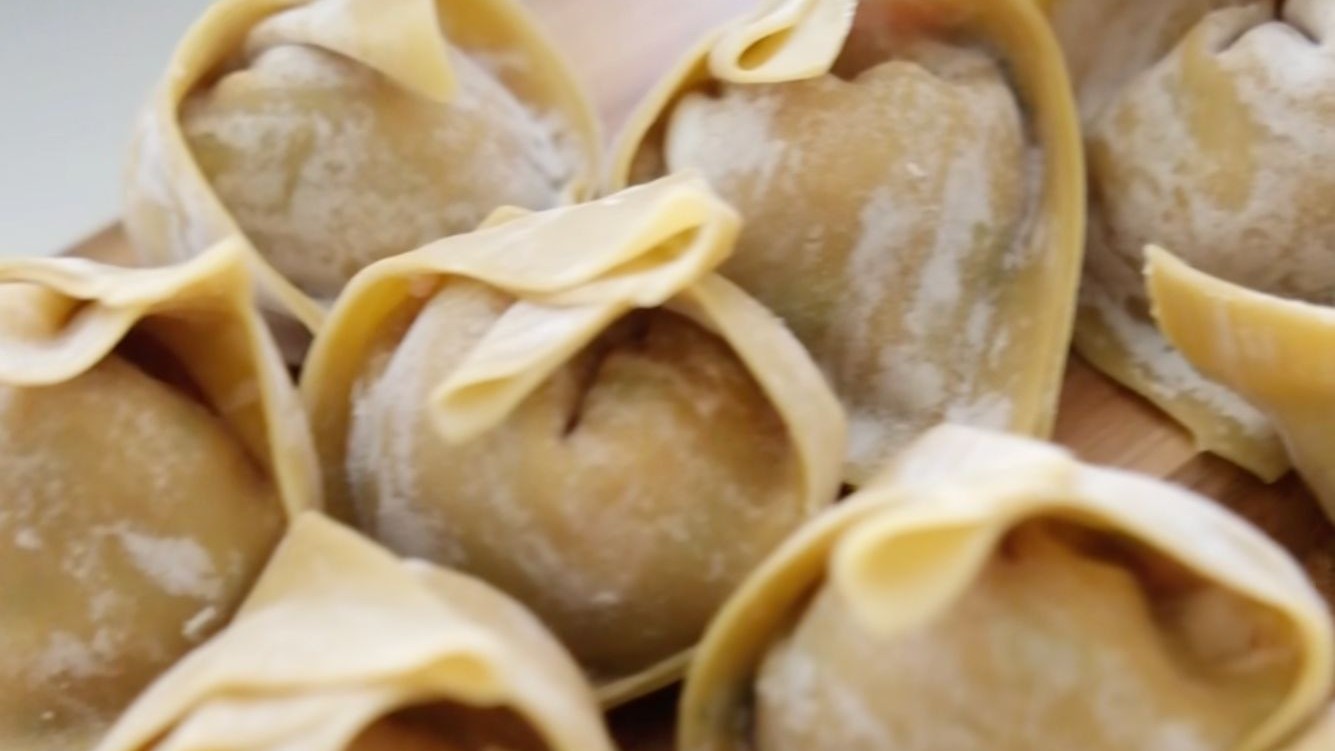 Image of Juicy Wontons in Mushroom Broth