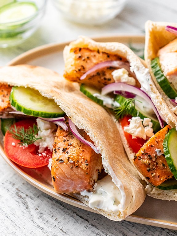 Image of While salmon cooks, stir together ingredients for tzatziki sauce. Spread...