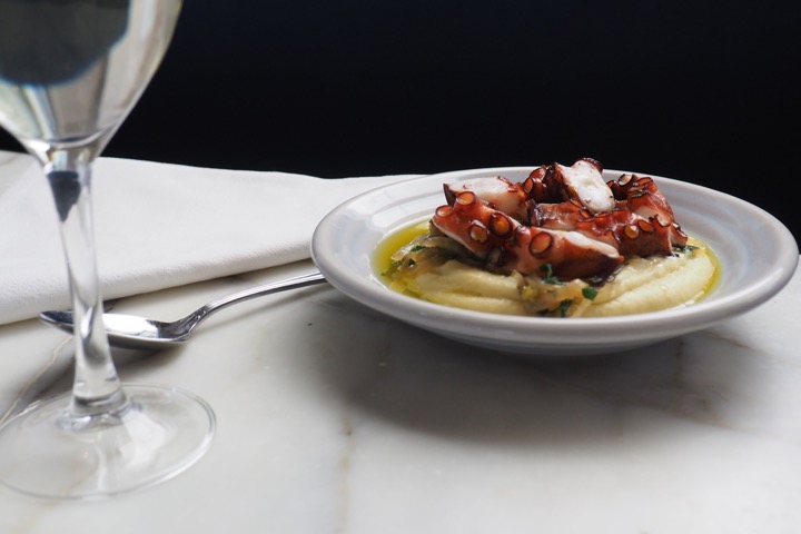 grilled octopus with braised onions & faba bean purée