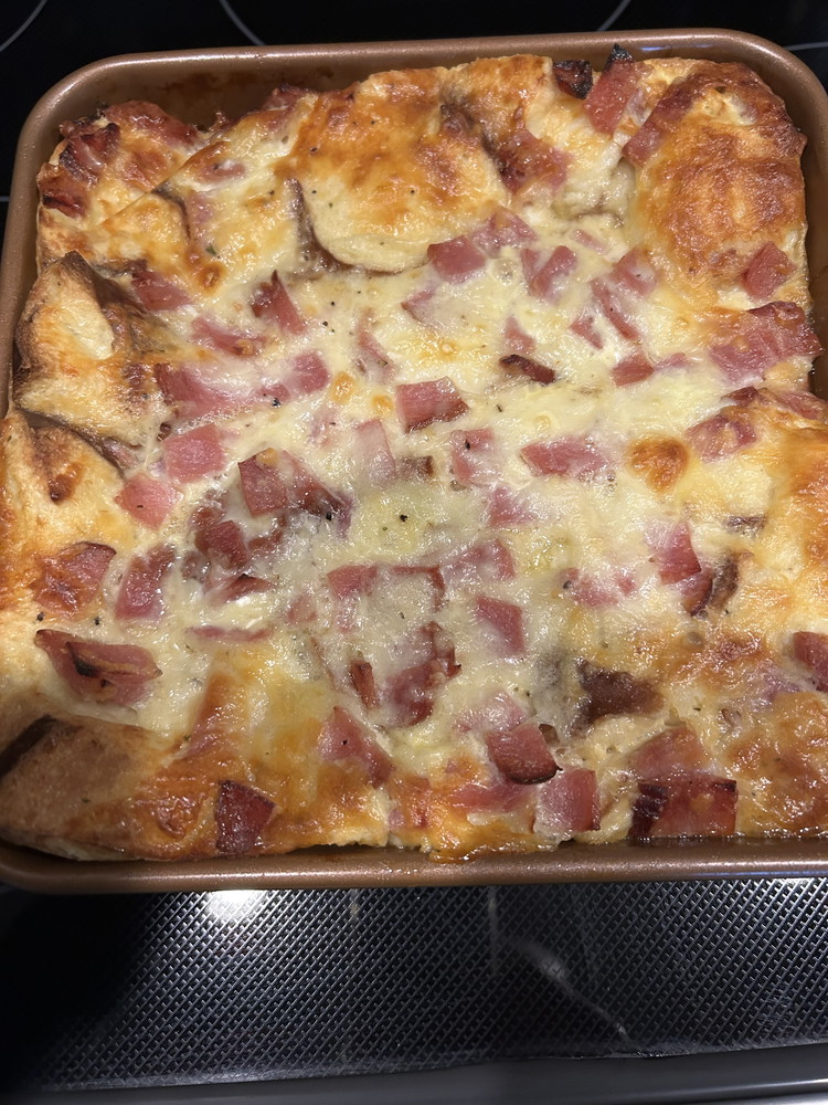 Image of Preheat the oven to 350° F. Uncover the casserole and bake until the top is golden brown and the casserole is set, 45 to 55 minutes. Let cool for 5 to 10 minutes before cutting and serving.