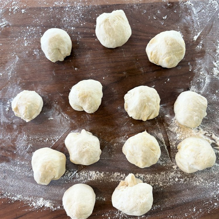 Image of Roll each piece of dough into a ball. Make the...