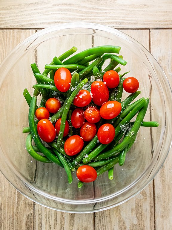 Image of Remove baking sheet from oven and add green beans and...