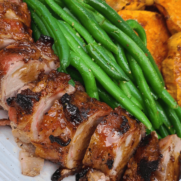 Image of Serve and enjoy your delicious grilled brown sugar bourbon glazed bacon-wrapped boar tenderloin with your favorite sides.