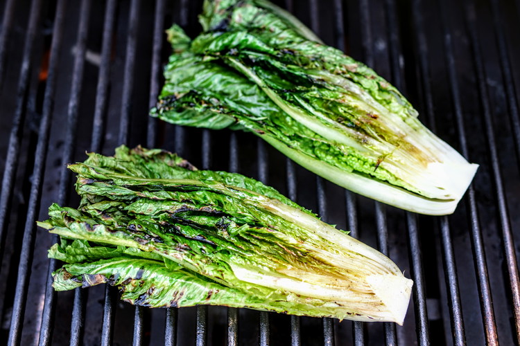 Image of Set the lettuce cut side down onto the grill. It is likely that you have some flare ups from the olive oil.  Don’t worry this will be fast.  Close the lid.   After about 30 seconds flip the lettuce carefully and...