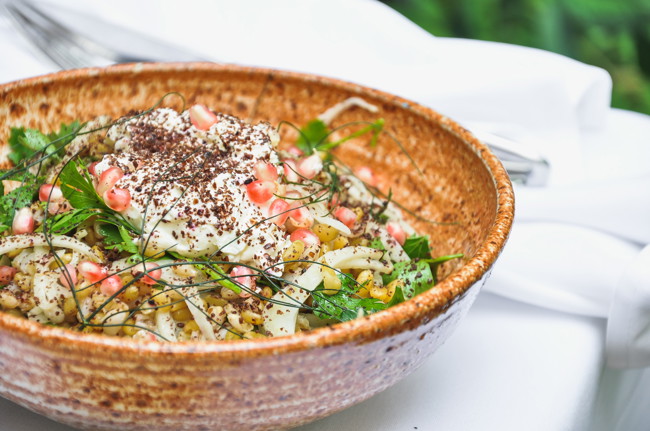 Image of mixed grain salad with pickled fennel, pomegranate, sumac & labne