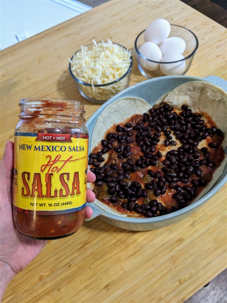 Image of Top the tortilla layer with half the black beans, ½...