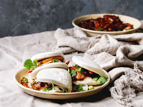 Gua-bao: steamed Chinese bun filled with duck and caramelized onion