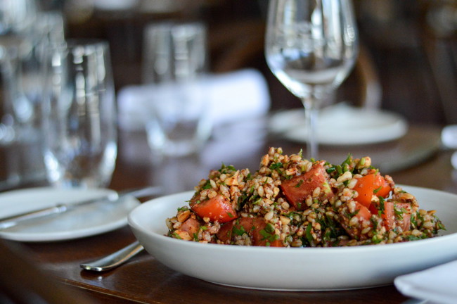 Image of chopped tomato, barley, almond & sumac salad