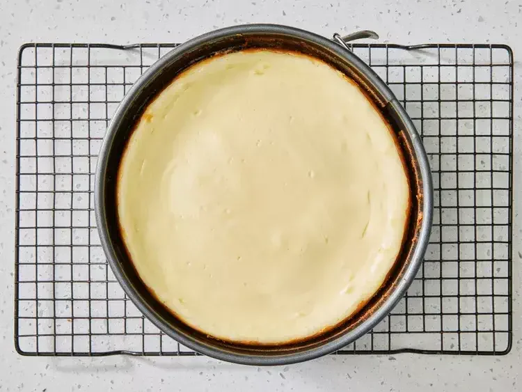 Image of Refrigerate:Once the cheesecake has cooled, cover it with plastic wrap...