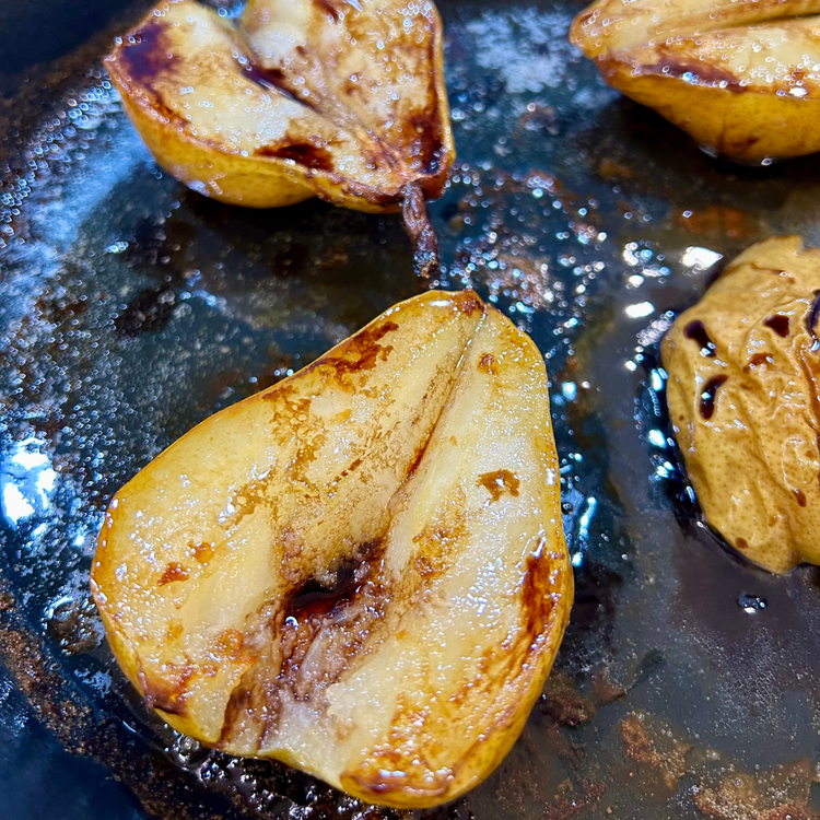 Image of Remove the pears from the oven and drizzle with 3 tablespoons balsamic and return to the oven for 5 minutes.