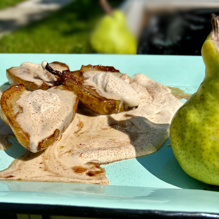 Image of After that, remove from the pan and place the pears on a serving dish, pour the other 2 teaspoons of warmed honey over them equally and dollop with the mascarpone cream, dust with cinnamon, and serve immediately.