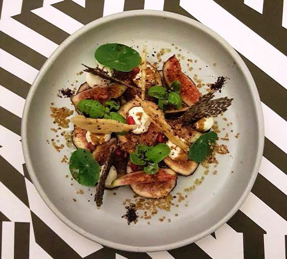 Image of black mission figs with holy goat fromage frais, pomegranate & toasted quinoa