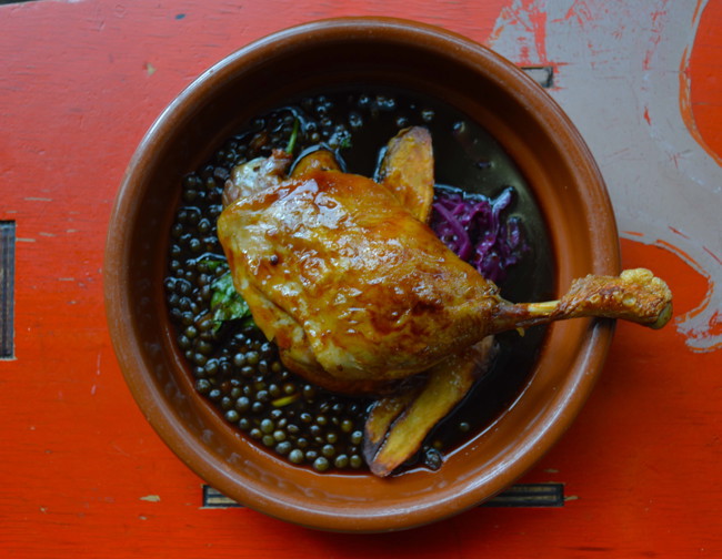 Image of twice cooked duck leg with green lentils