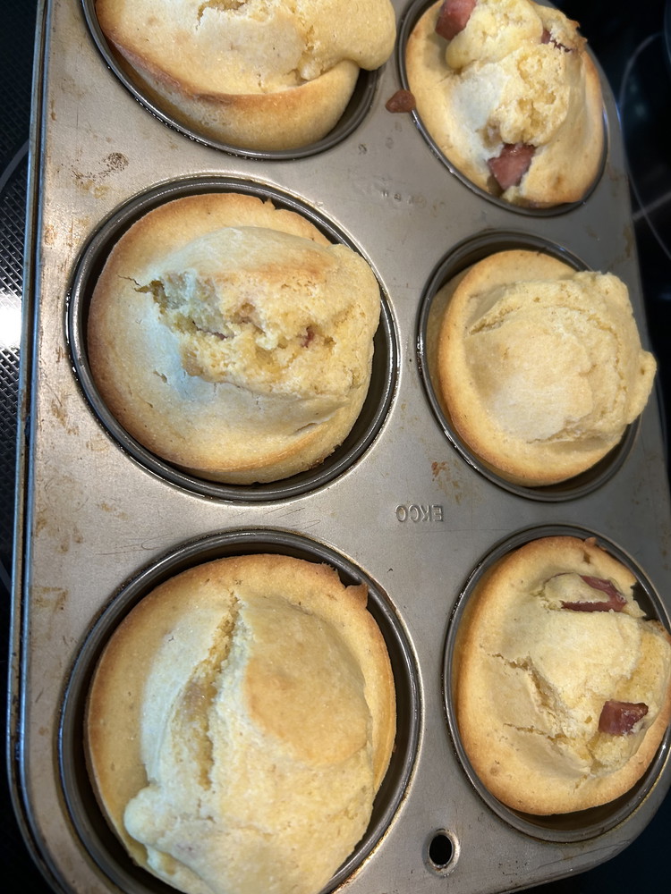 Image of Spoon batter into muffin pan, filling almost all the way to the top. Bake for 17-20 minutes. Use a toothpick to test. If it comes out clean, the muffins are done.