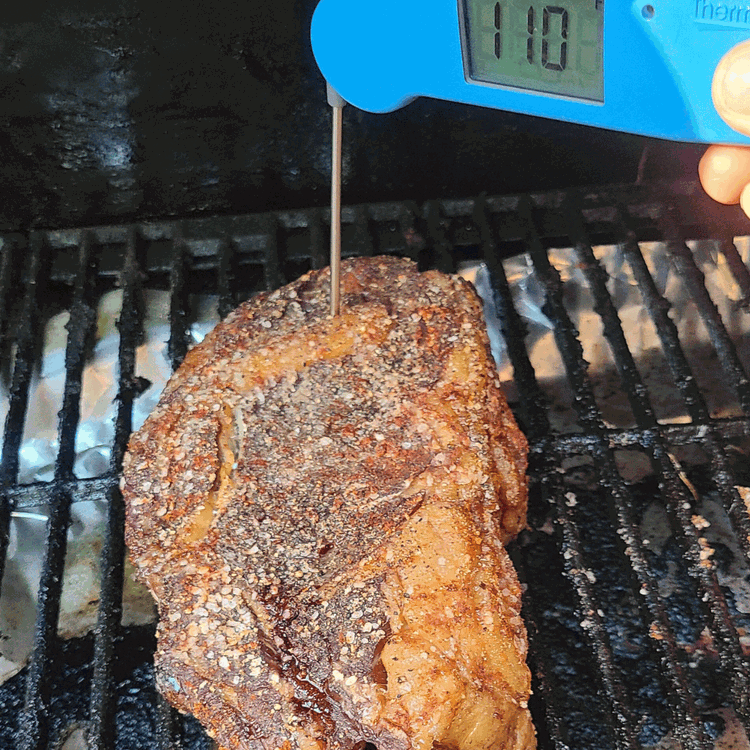 Image of Smoke the steak until it reaches an internal temperature of 110-115°F (49-52°C) for about 1-1.5 hours. Adjust the smoking time if you prefer a different level of doneness.