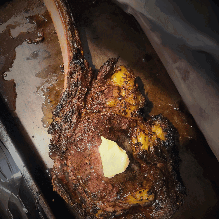 Image of Remove the steak from the grill. Place 1 tbsp butter on top of the bison steak, and cover loosely with foil. Let the steak rest for another 10-15 minutes to allow the juices to redistribute throughout the meat.