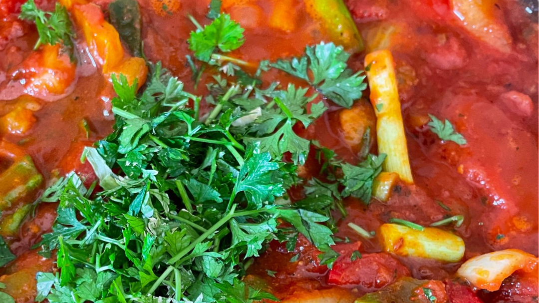 Image of Taktouka (Moroccan cooked peppers and tomato salad) with Parsley-Persian Lime Drizzle
