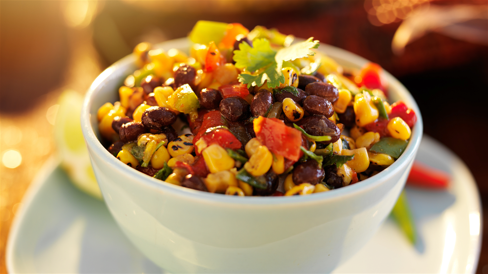 Image of Fresh Summer Salad with Grilled Corn, Black Beans, Cherry Tomatoes and Avocado