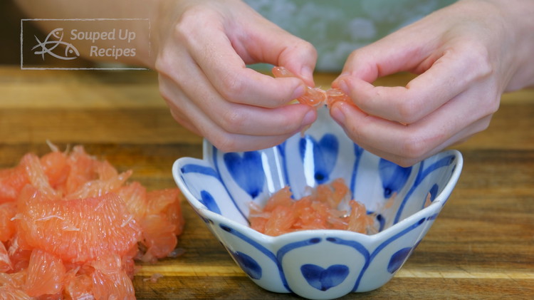 Image of Carefully peel off the translucent membrane and take the grapefruit meat out. Tear the meat into small shreds; try not to squeeze the pulp if possible. In China, you are supposed to use red pomelo, which is bigger and sweeter than grapefruit, but I couldn't find...