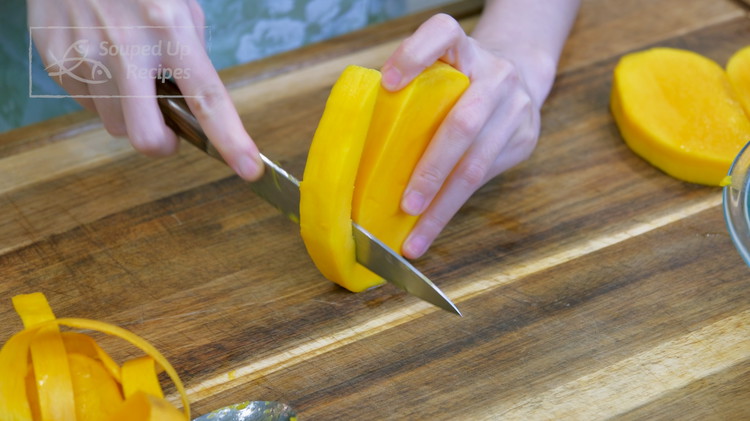 Image of There is still some flesh attached to the seed. Don't waste it. Remove the skin first, cut of the meat as much as you can, then use a spoon to scrape the last little bit.