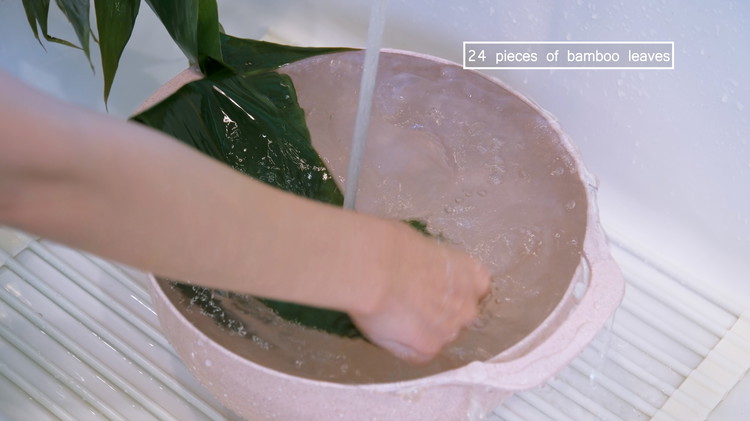 Image of During this time, prepare the bamboo leaves. If using dried bamboo leaves, add them to a big pot filled with water and bring to a boil. Then turn off the heat and let the leaves soak in the hot water...