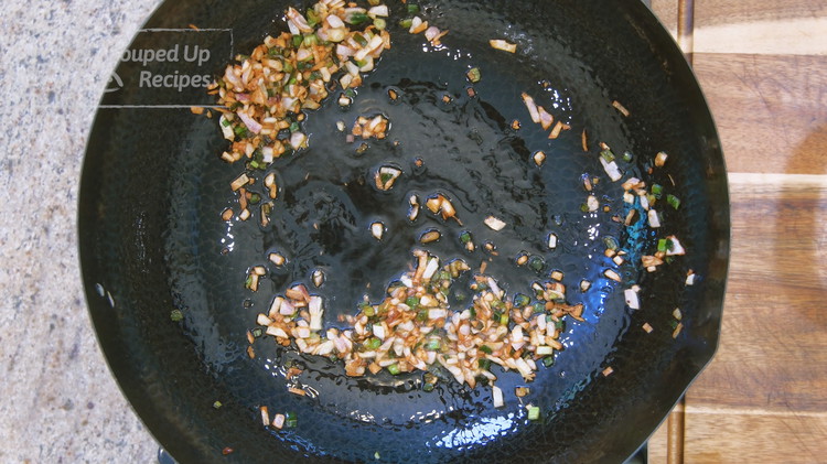 Image of Turn the heat to medium and preheat the wok until hot. Add a few tablespoons of cooking oil, some diced shallots and minced scallions. Stir over low heat for a few minutes or until they are golden brown. This will...