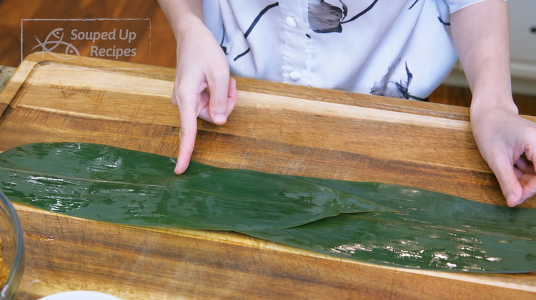 Image of Wrapping the zongzi is probably the most challenging part of this recipe. The first thing you need to do is to distinguish the rough and smooth sides of the bamboo leaves. The rough side has a convex stem; it should be facing...