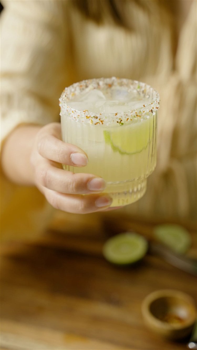 Image of Pour into salted glass, garnish with lime wedge from earlier,...