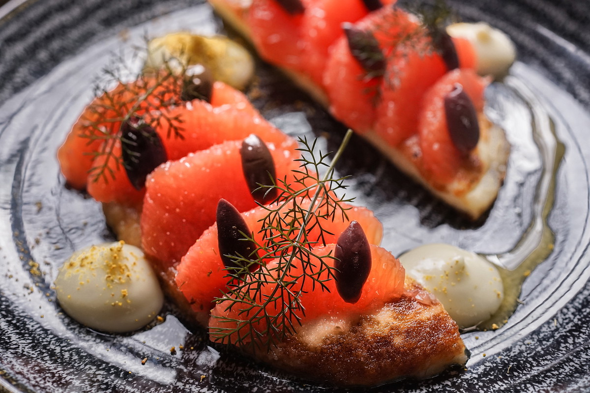 pan-fried halloumi with honey, ruby grapefruit, black olives & fennel purée