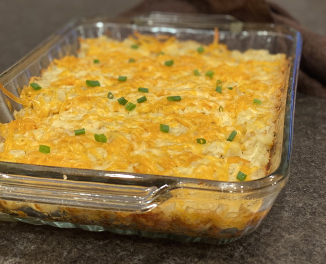 Casserole dish of cheesy ranch potatoes