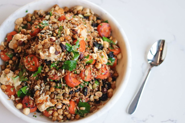 Image of farro & roasted carrot salad with raisins, harissa & chickpeas