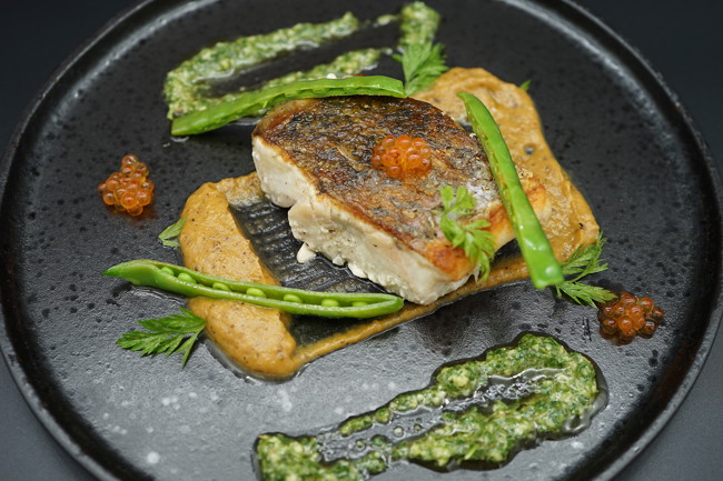 Image of confit barramundi with tarragon gremolata, pumpkin & caviar