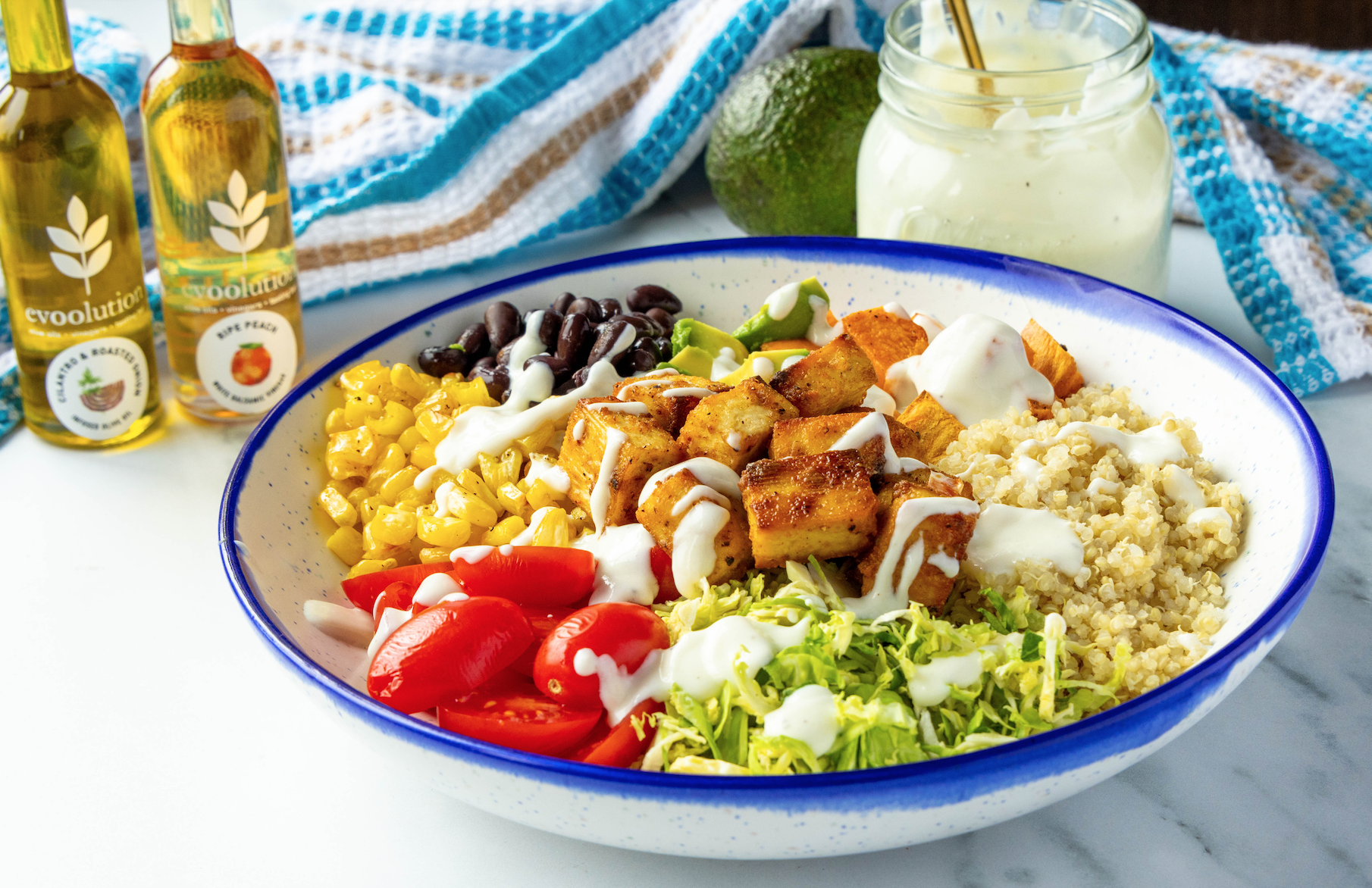 Image of Crispy Tofu Veggie Bowl with Cilantro & Roasted Onion Olive Oil and Ripe Peach Balsamic