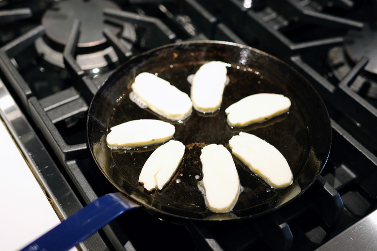 Image of Halloumi is often sold in plastic blocks with a small amount of brine in the packaging.  You want to slice the block in about ¼ slices.  Add a very small coating of olive oil (About 1 tablespoon) to a nonstick...