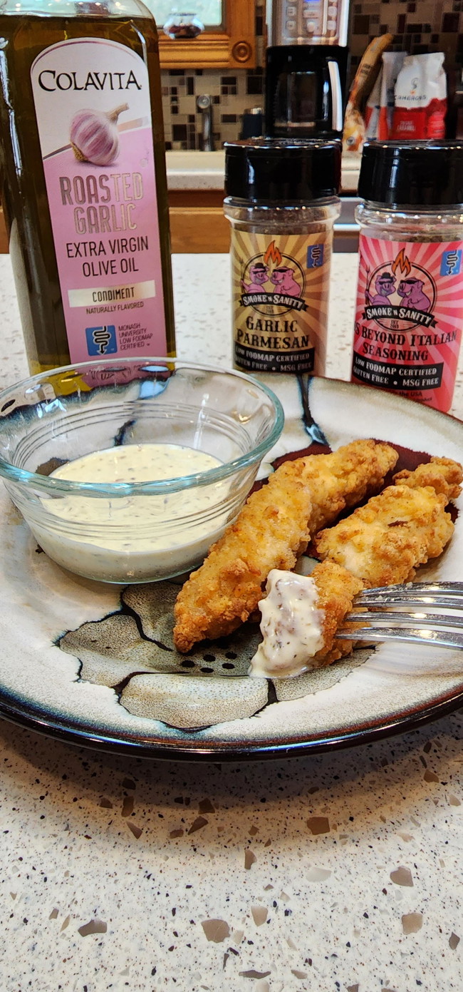 Plate of chicken tenders with garlic parmesan dip