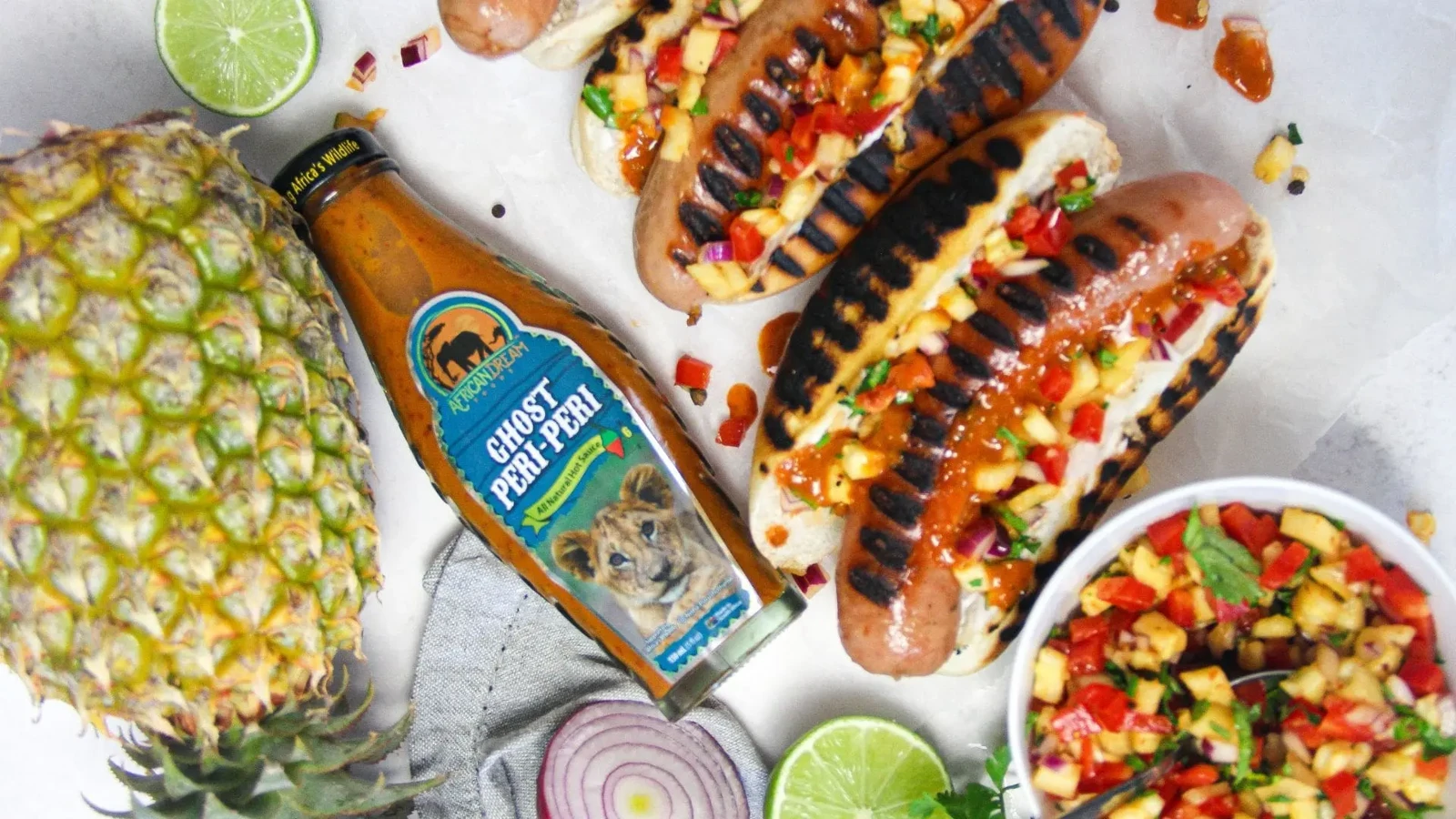 Image of Grilled Hotdogs with Ghost Peri Peri Pineapple Salsa