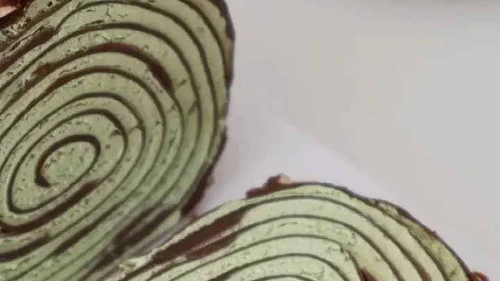 Image of Matcha Crepe Cake Roll with Chocolate Glaze