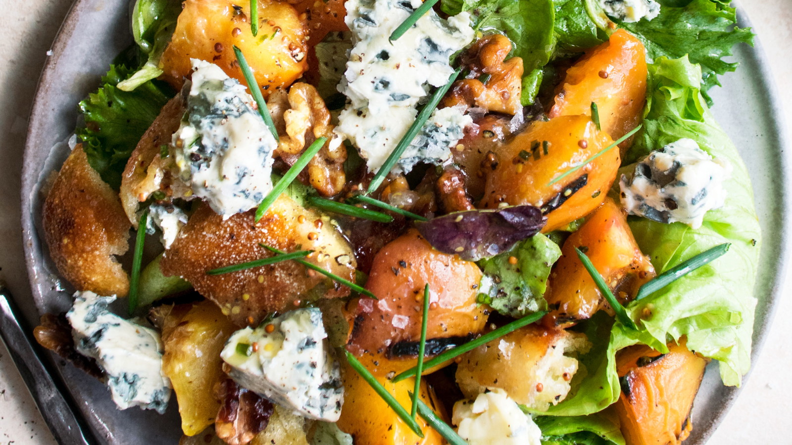 Image of Grilled Peach Salad w/ Candied Nuts and Feta