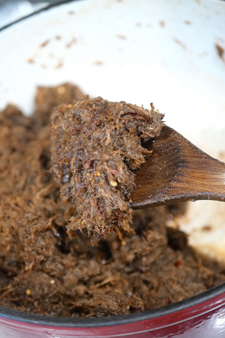 Image of Continuously stir the beef on medium heat until moisture cooks out and the beef browns. Add dried chilli flakes or any dry spices of choice.