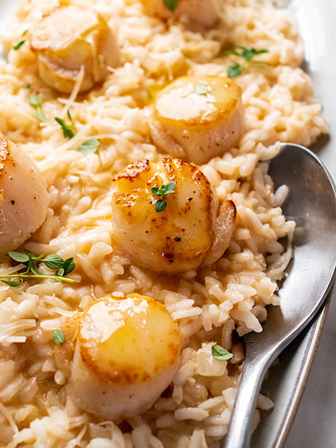 Image of Serve scallops over risotto topped with remaining Parmesan cheese and...