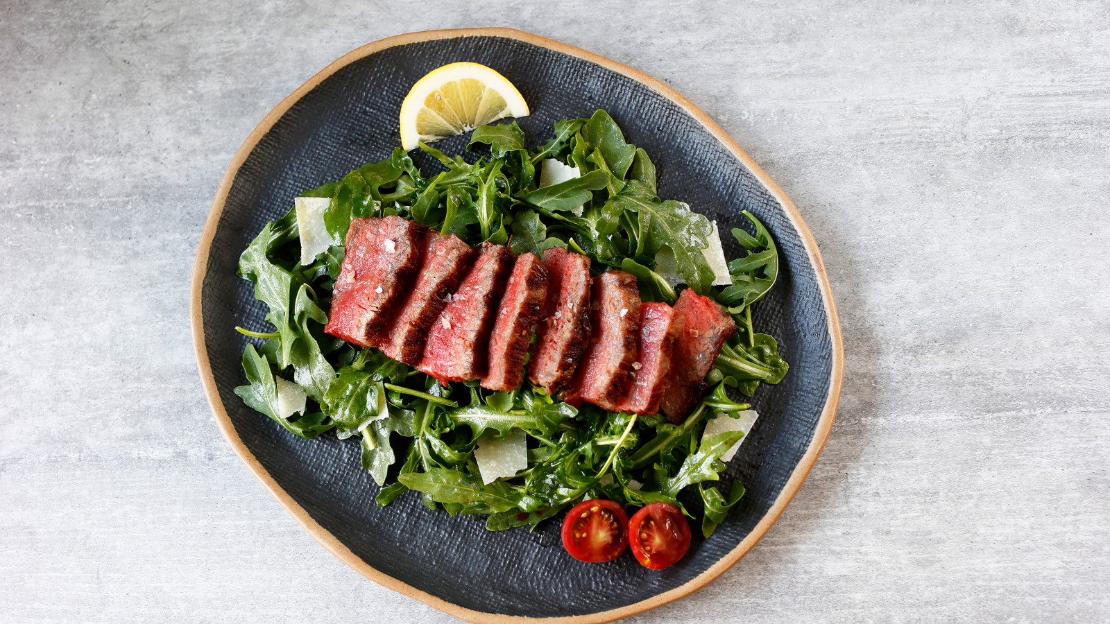 Image of Tuscan-Style NY Strip with Arugula Salad