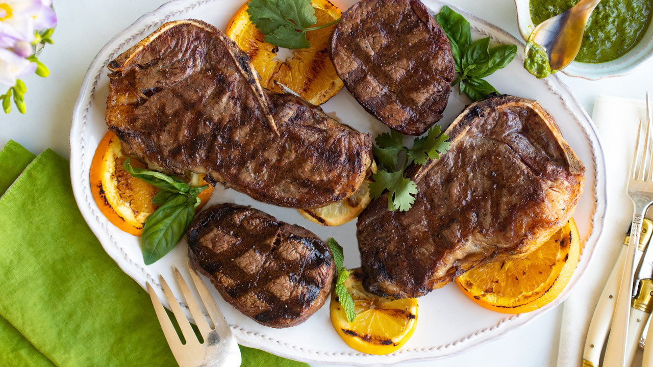 Image of Grilled NY Strip Steak and Filet Mignon with Citrus Caper Herb Sauce