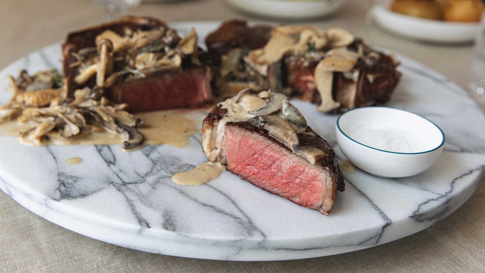 Image of Bone-In NY Strip with Wild Mushroom Cream Steak Sauce