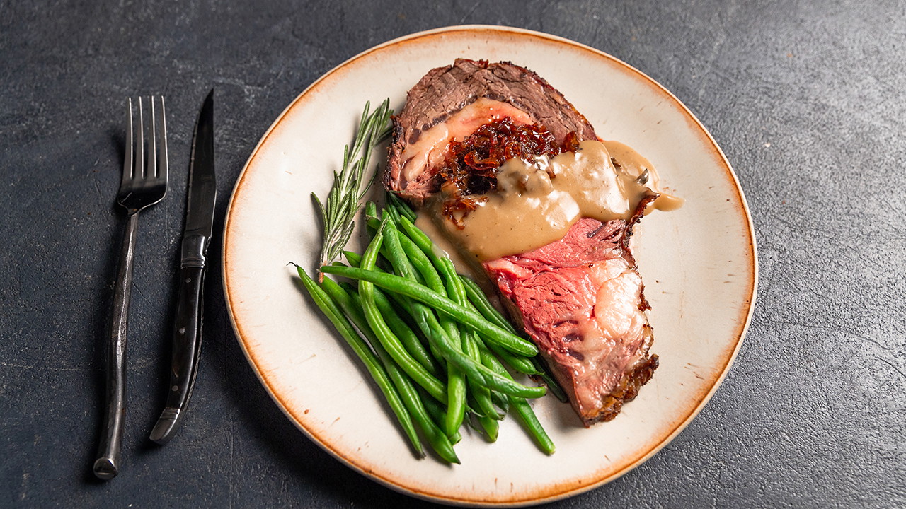 Image of Bone-In Prime Rib with Shallot-Red Wine Jam & Black Pepper Gravy