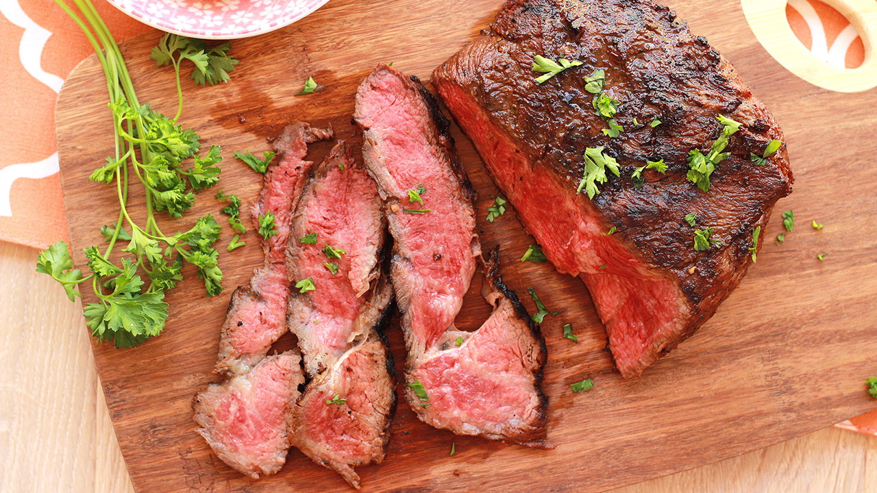 Image of Grilled Marinated Flat Iron Steak with Creamy Polenta and Roasted Tomatoes